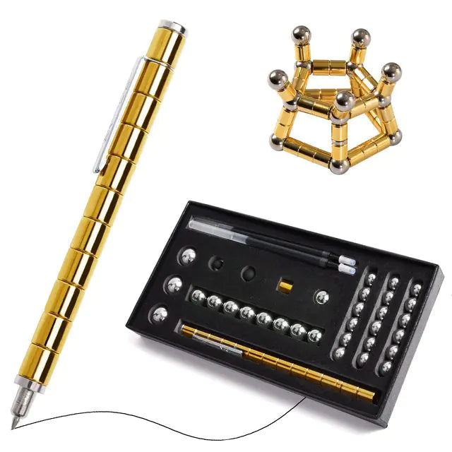 Gold pen, geometric metal puzzle, and black box with components on a white background