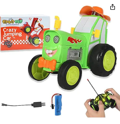 Toy tractor with remote control, battery pack, and packaging on a white background