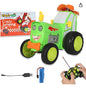 Toy tractor with remote control, battery pack, and packaging on a white background
