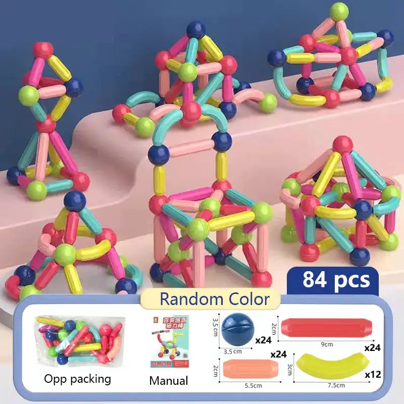 Colorful magnetic building blocks set on a pink surface with packaging details.
