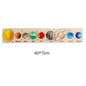 Wooden puzzle with colorful representations of planets on a white background