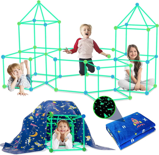 Children playing with a green geometric play set, surrounded by a blue tent with space-themed design.