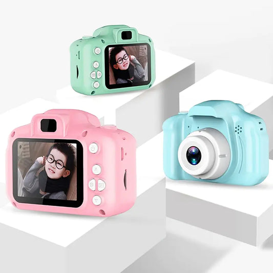 Three colorful toy cameras on a white background